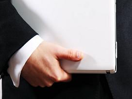 business man holding laptop