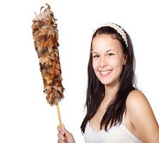 girl holding a cleaning duster