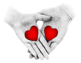 hands holding with red hearts