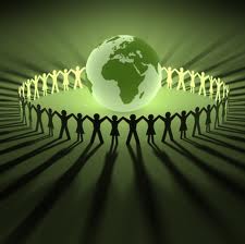 humanity and people holding hands surrounding glowing green earth