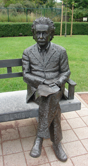 statue of albert einstein on bench
