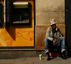 homeless man in front of building